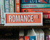 Romance Rd Acrylic Shelf Sign w/ Stand