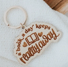 A Book a Day Keeps Reality Away Wooden Keychain